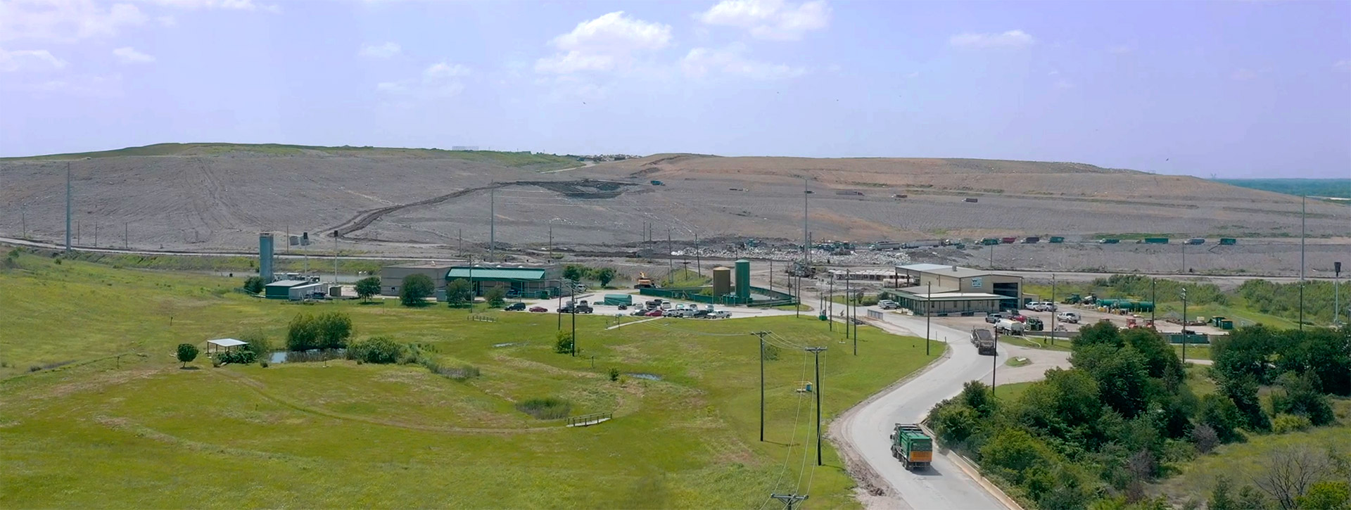 Image of recycling facility shows paper material moving on belt