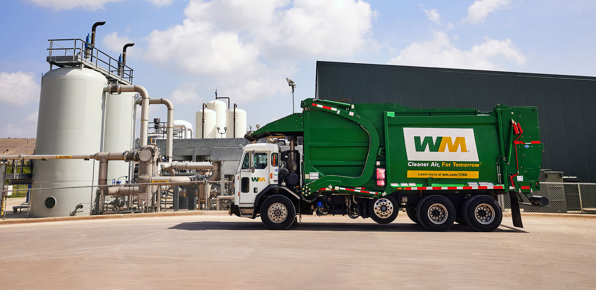 Image of recycling facility shows paper material moving on belt