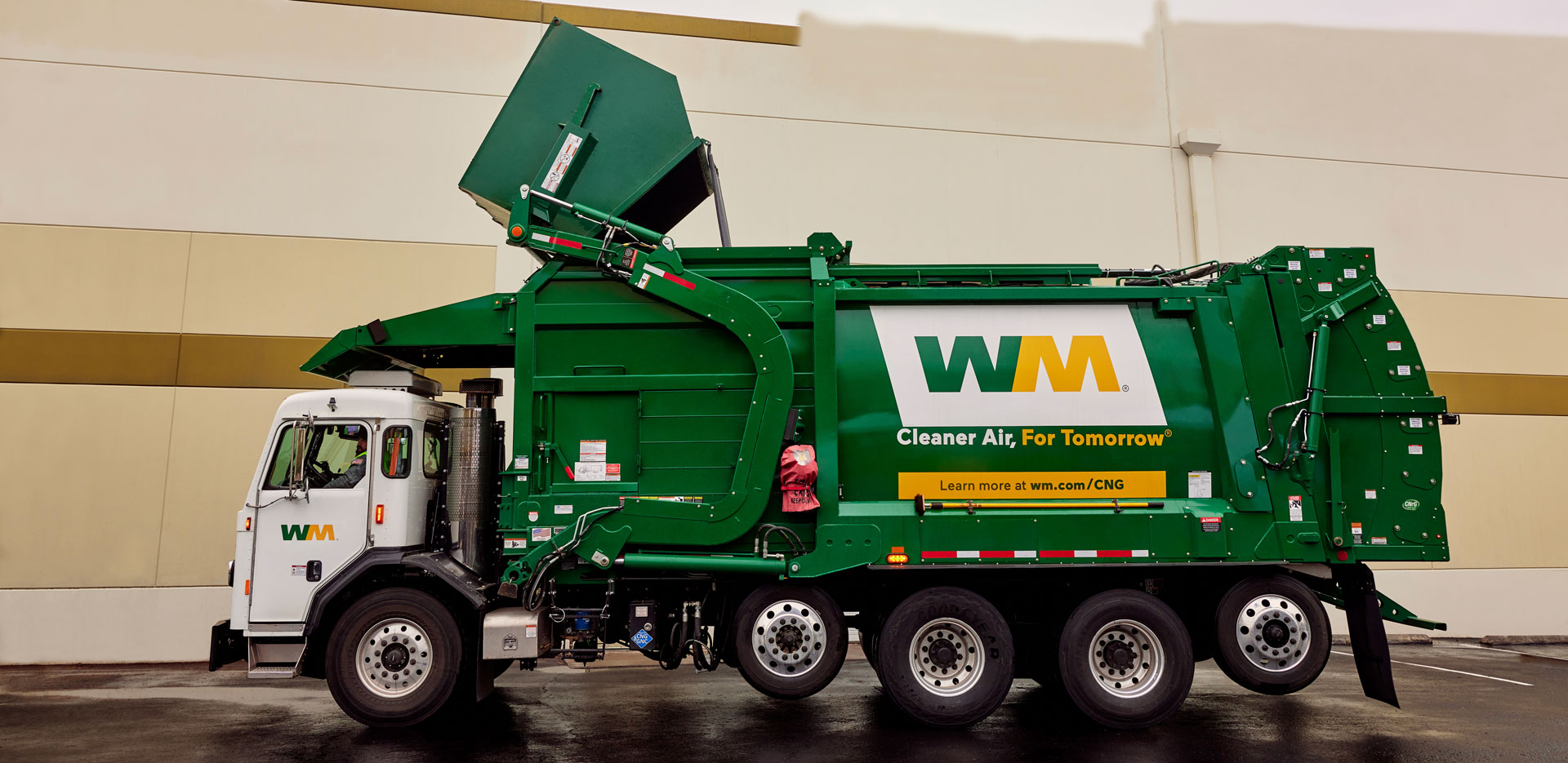 Image of recycling facility shows paper material moving on belt